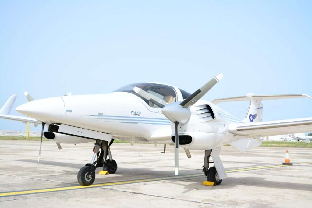 An exterior view of the Diamond DA42 (9H-STAR) parked on the apron, showcasing its sleek twin-engine design and composite airframe. The aircraft's modern features and aerodynamic profile highlight its role as a key training asset at the European Pilot Academy